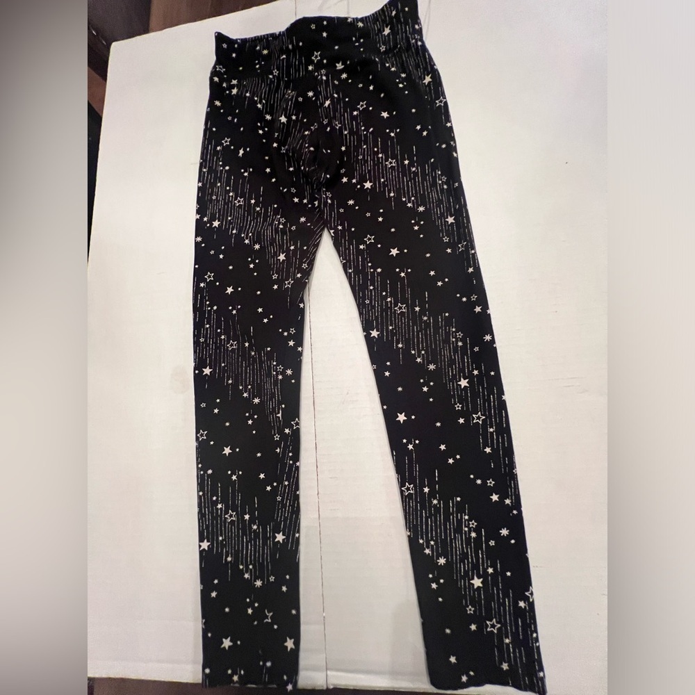 JUSTICE GIRLS LEGGINGS. SIZE 14/16  BLACK WITH STARS AND LINES